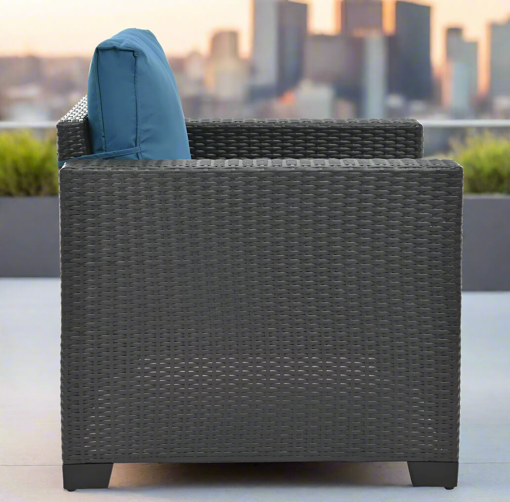 A sofa from the 10 pieces of the Wicker Sectional Patio Set sold by WorkZen Interiors