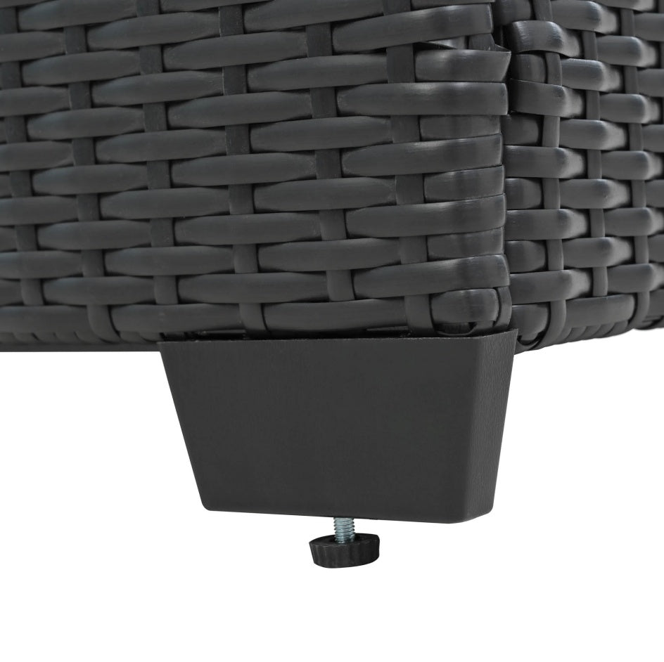 The foot of a chair which is part of the 10 pieces of the Wicker Sectional Patio Set sold by WorkZen Interiors
