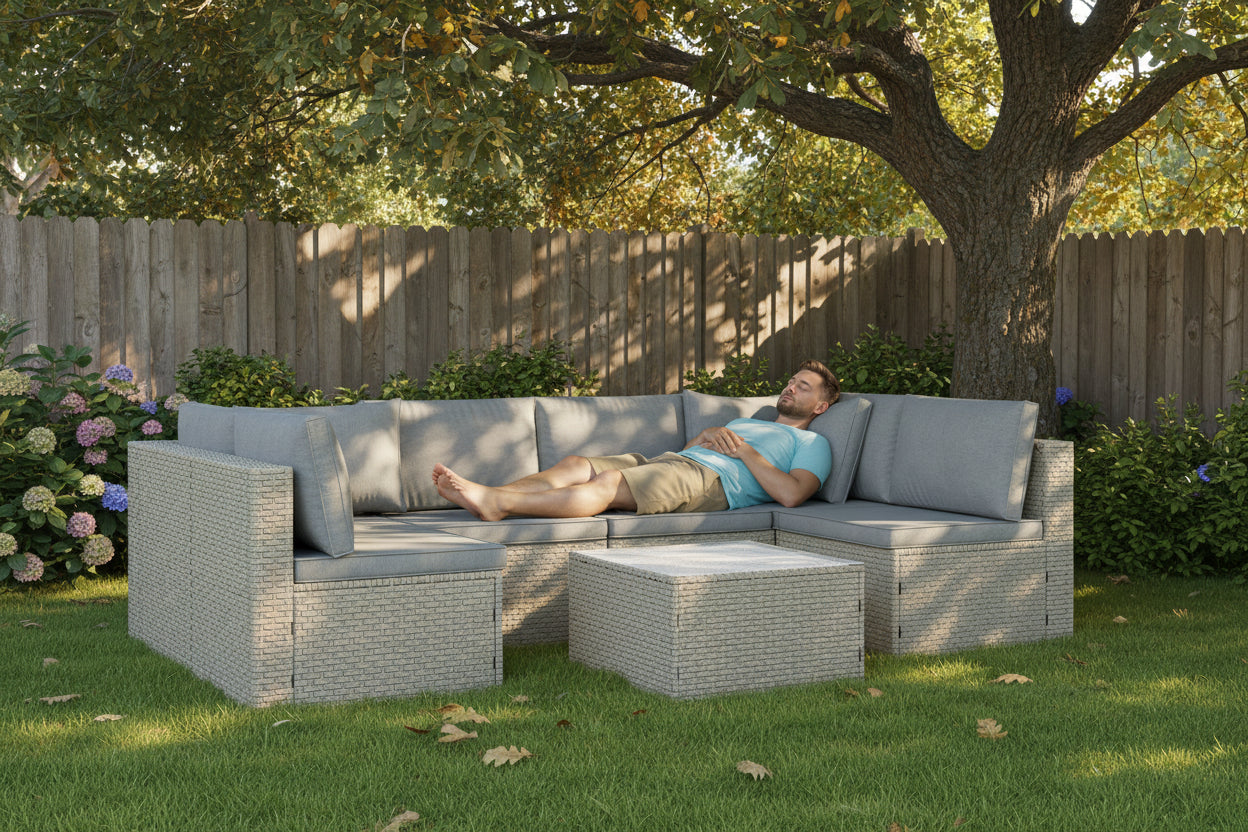 Outdoor furniture set with a sectional sofa and ottoman on a white background