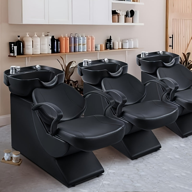 Row of hair salon backwash units in a salon setting with shampoo bottles on shelves.