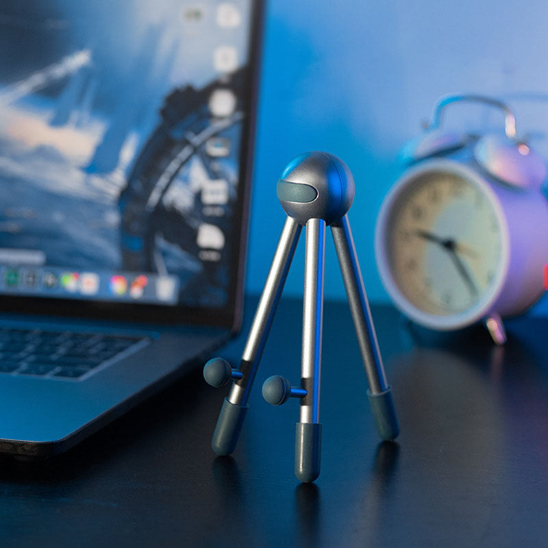 A silver desk phone holder sold by WorkZen Interiors