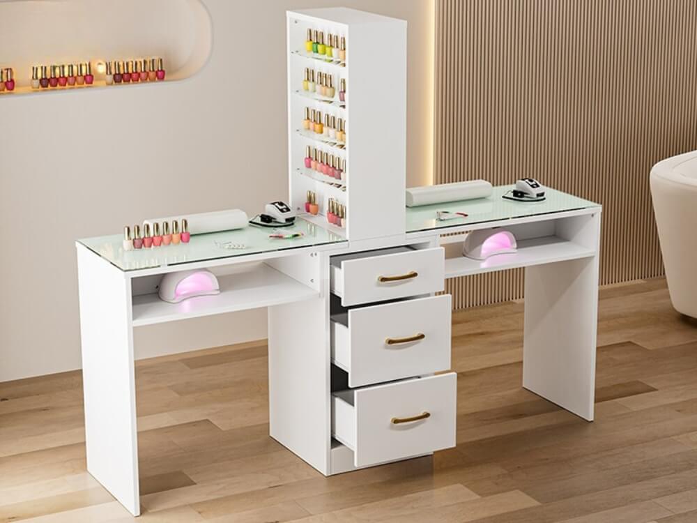 A white double manicure table sold by WorkZen Interiors