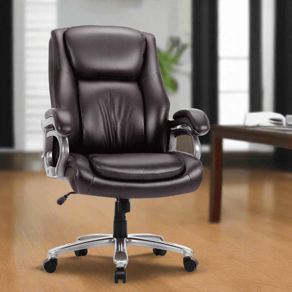 A brown high back office chair manufactured by Colamy positioned beside a table in an office and sold by WorkZen Interiors
