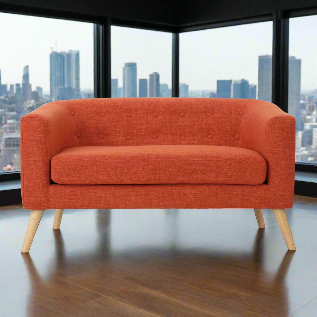 The front of an orange lounger sofa sold by WorkZen Interiors