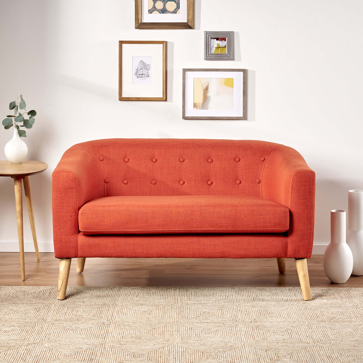 The front of an orange lounger sofa sold by WorkZen Interiors