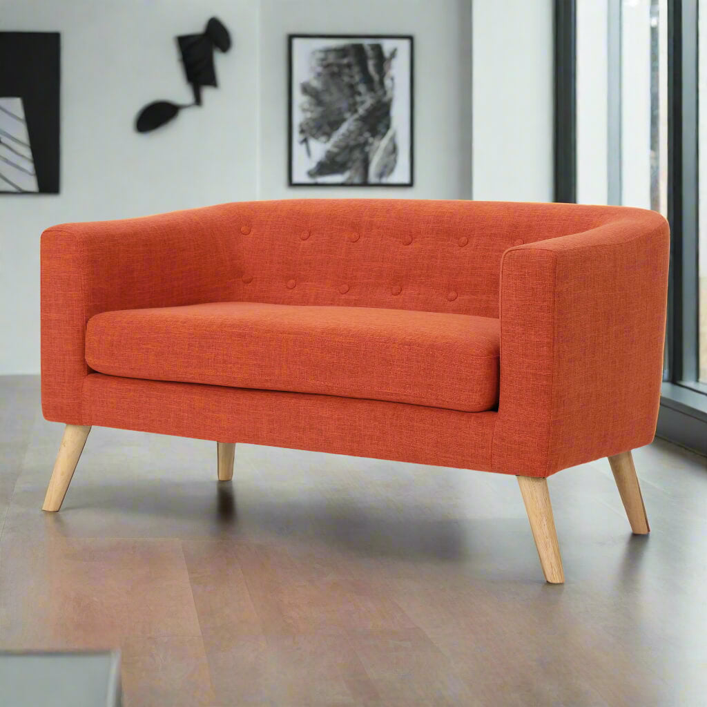 An orange lounger sofa sold by WorkZen Interiors