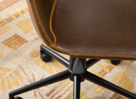 The side of a Swiveling Office Chair showing the adjustable leg of the chair and the roller caster.