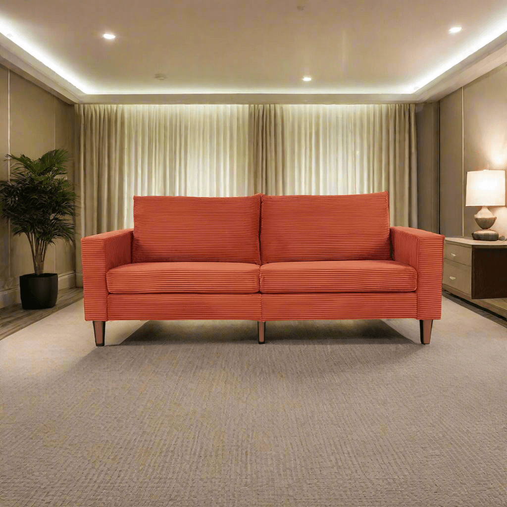A professionally decorated office lounge with an orange Venetian Double Chaise Lounge Sofa sold by WorkZen Interiors