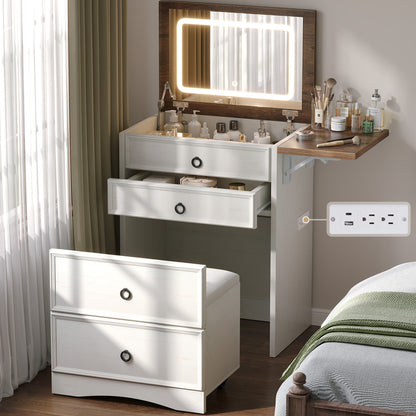 Vanity set with lighted mirror with mirror and drawers in a bedroom setting.