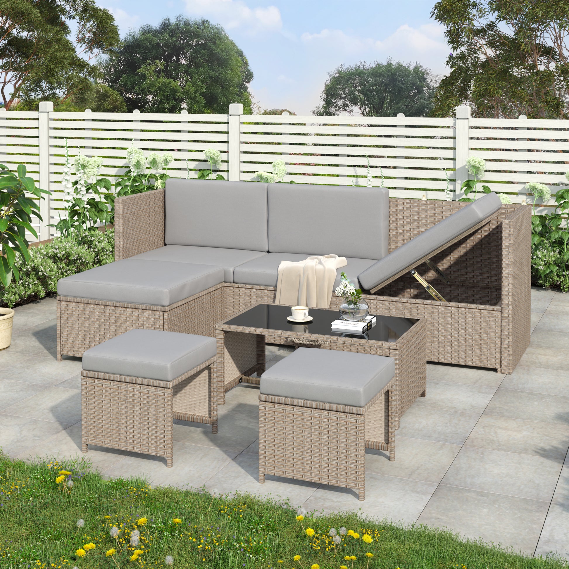 Contemporary rattan sofa set with beige wicker and gray cushions on a patio.