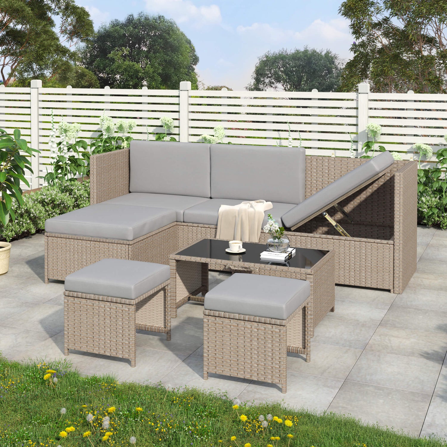 Outdoor patio furniture set with beige wicker and gray cushions on a patio.