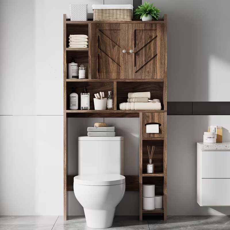 An over the toilet storage cabinet with doors​ in a modern bathroom setting.