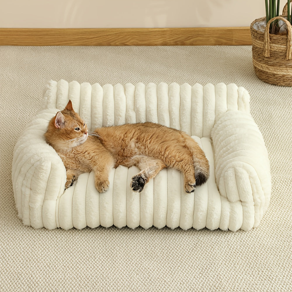 Cat lying on a fluffy white cat sofa in a cozy room.