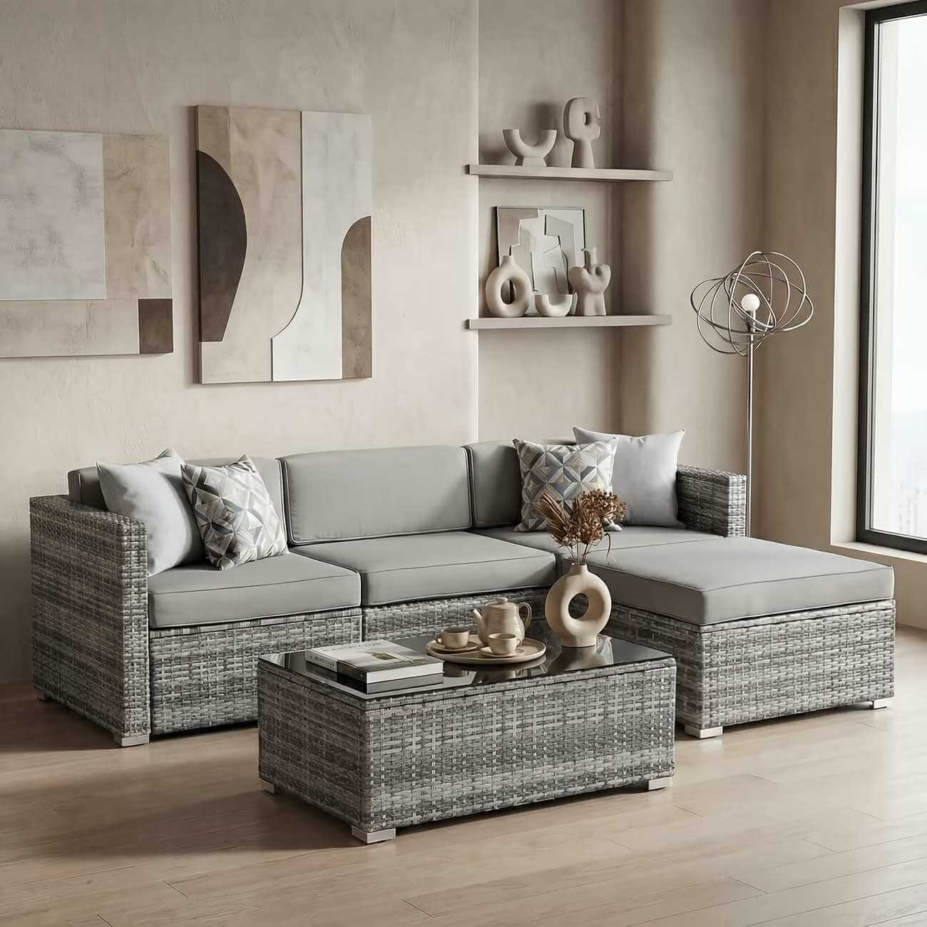 Gray outdoor furniture set with cushions in a modern living room.