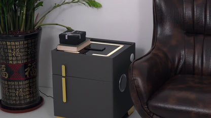 Modern side table with a plant and leather chair in a room setting