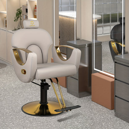 Beige reclining barber chair with gold accents in a modern salon setting