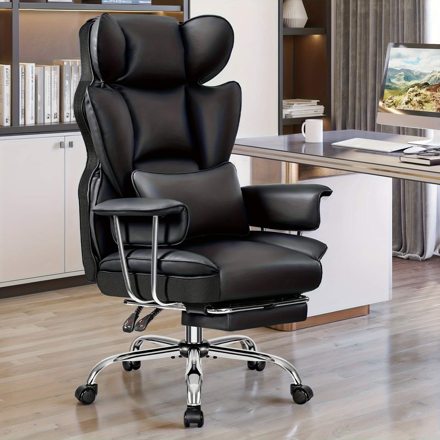 Black executive office chair in a home office setting with a desk and computer monitor.