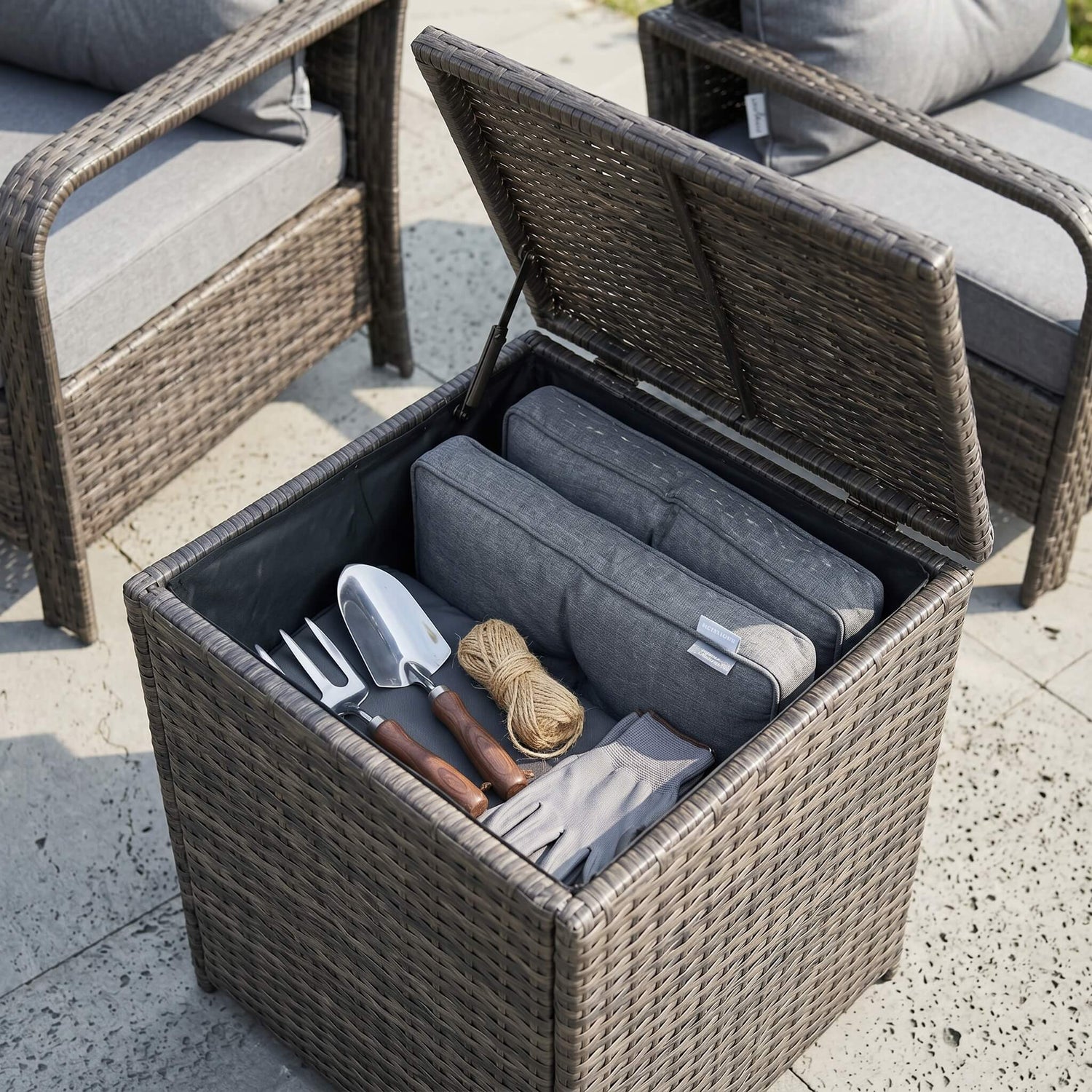 3 Pieces Rattan Bistro Set that is made up of 2 chairs and a coffee table.