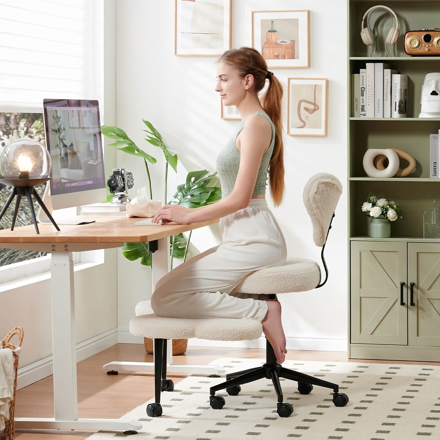 Woman sitting on a adhd chair at a desk in a home office setting.