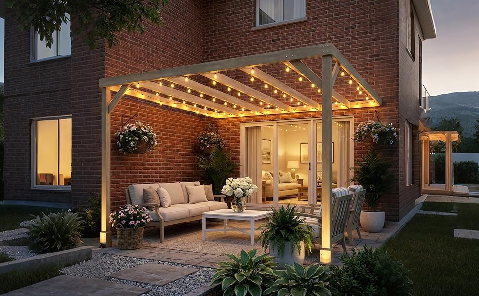 Patio with pergola, couch, and string lights in front of a house