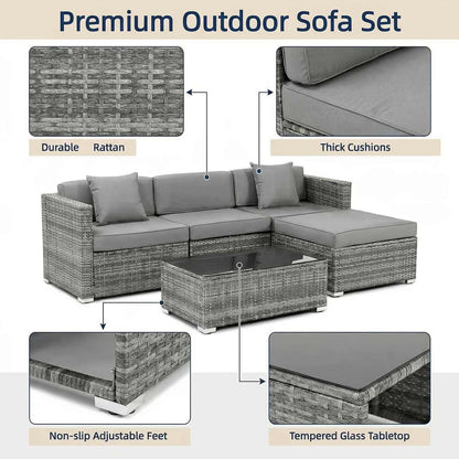 Outdoor sofa set with gray cushions and a coffee table, featuring durable rattan, thick cushions, non-slip adjustable feet, and a tempered glass tabletop.