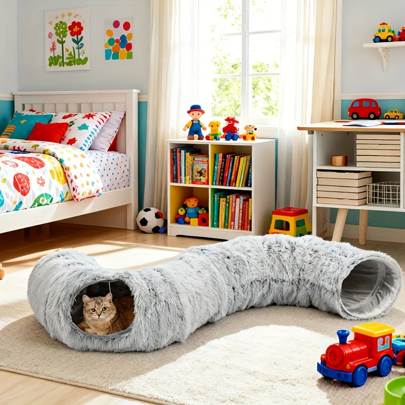 Cat playing with a tunnel in a child's room with toys and books.