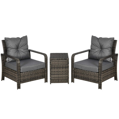 Two wicker chairs with gray cushions and a matching side table on a white background