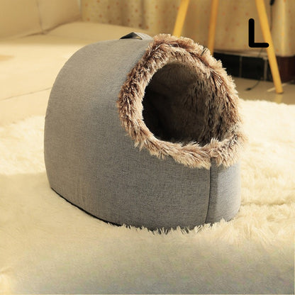 Gray cat cave bed with fluffy brown interior on a white carpet
