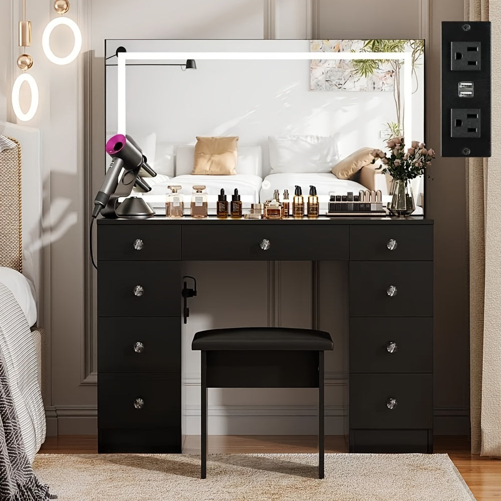 Black vanity desk with mirror, stool, and cosmetic products in a bedroom setting.