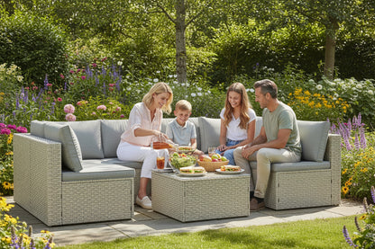Outdoor furniture set with a sectional sofa and ottoman on a white background