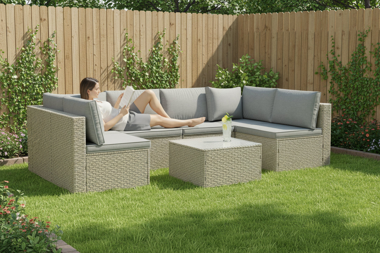 Outdoor furniture set with a sectional sofa and ottoman on a white background