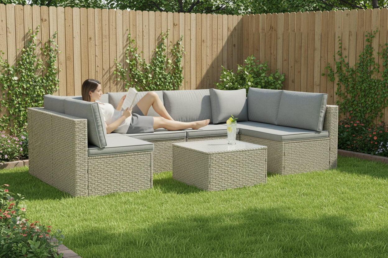 Person relaxing on a patio set in a garden