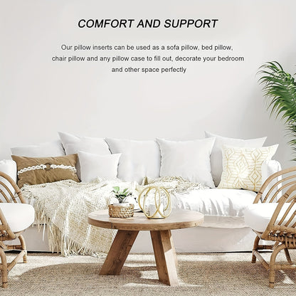 Living room with white sofa, wooden coffee table, and decorative pillows.