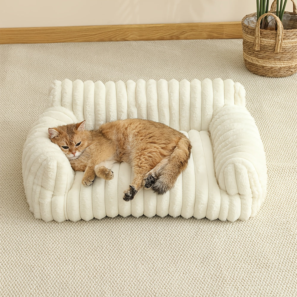 Cat lying on a white cat sofa with a neutral background