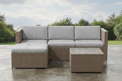 Outdoor furniture set with a sectional sofa and coffee table on a white background