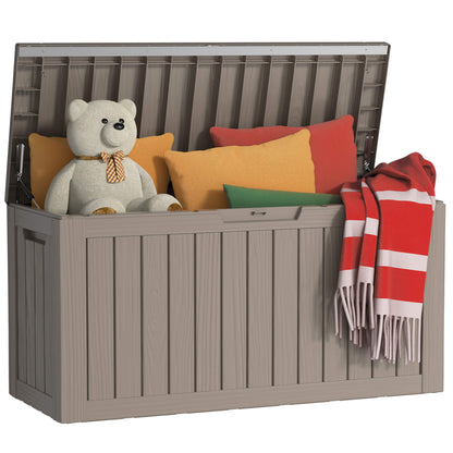 Gray storage bench with colorful cushions and a teddy bear on a white background