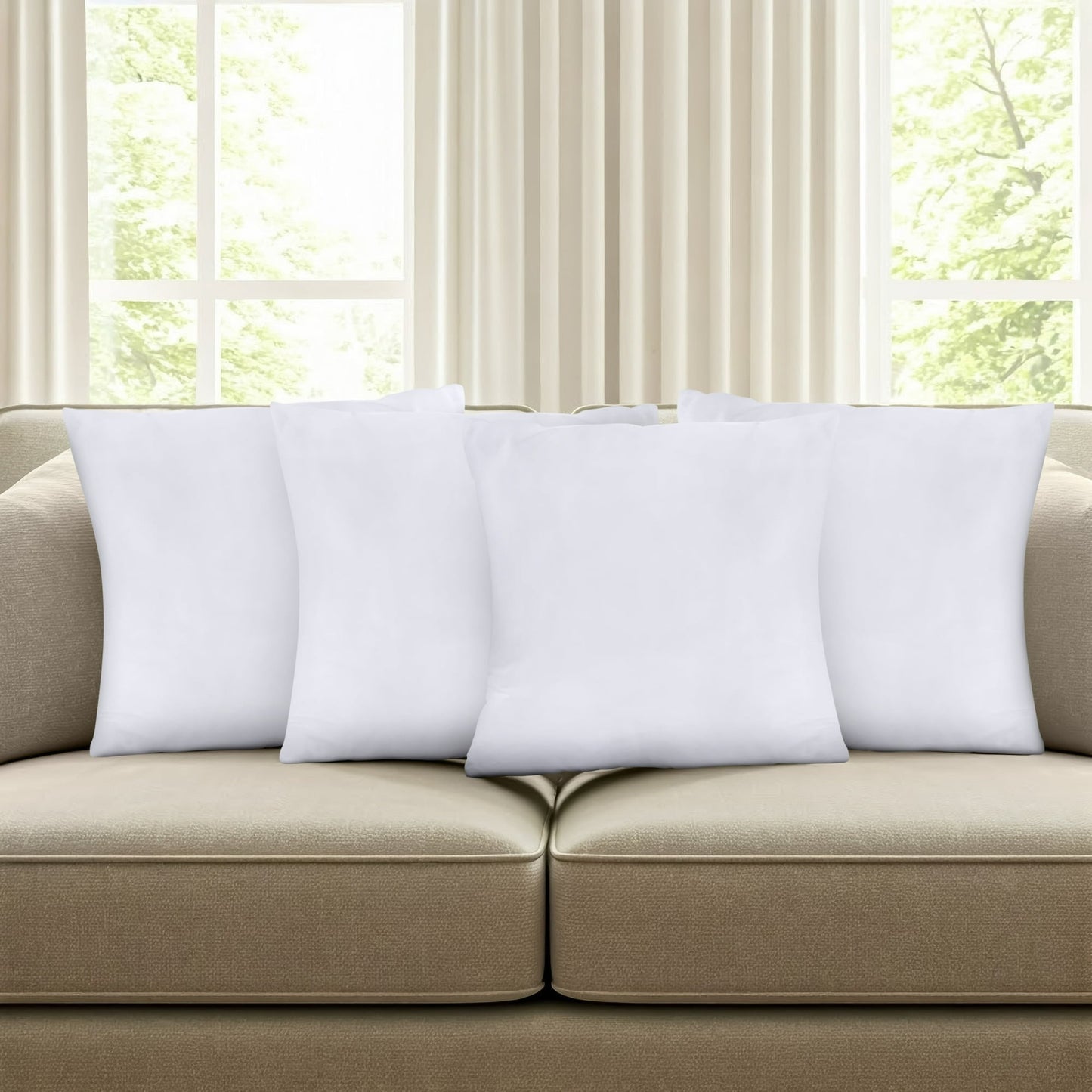 Beige sofa with white pillows in a room with large windows and curtains.