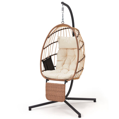 Hanging chair with beige cushion and black stand on a white background