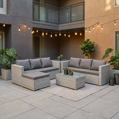 Light Grey Outdoor Rattan Garden Furniture Set located in a patio