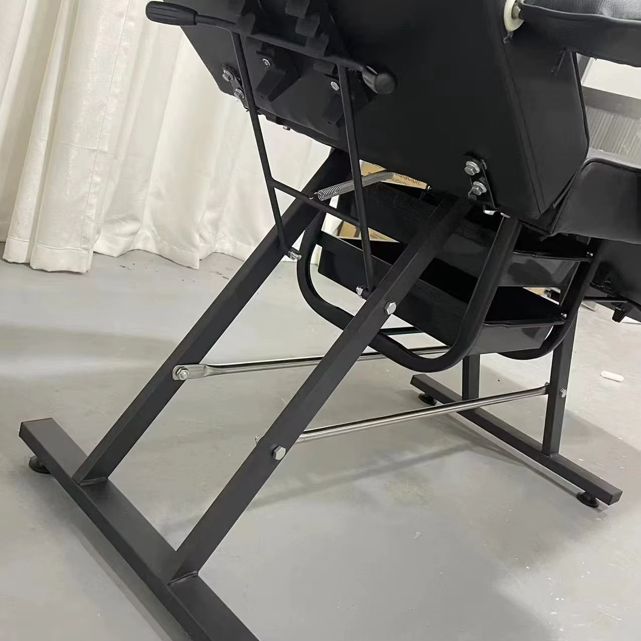 A black aromatherapy massage bed sold by WorkZen Interior