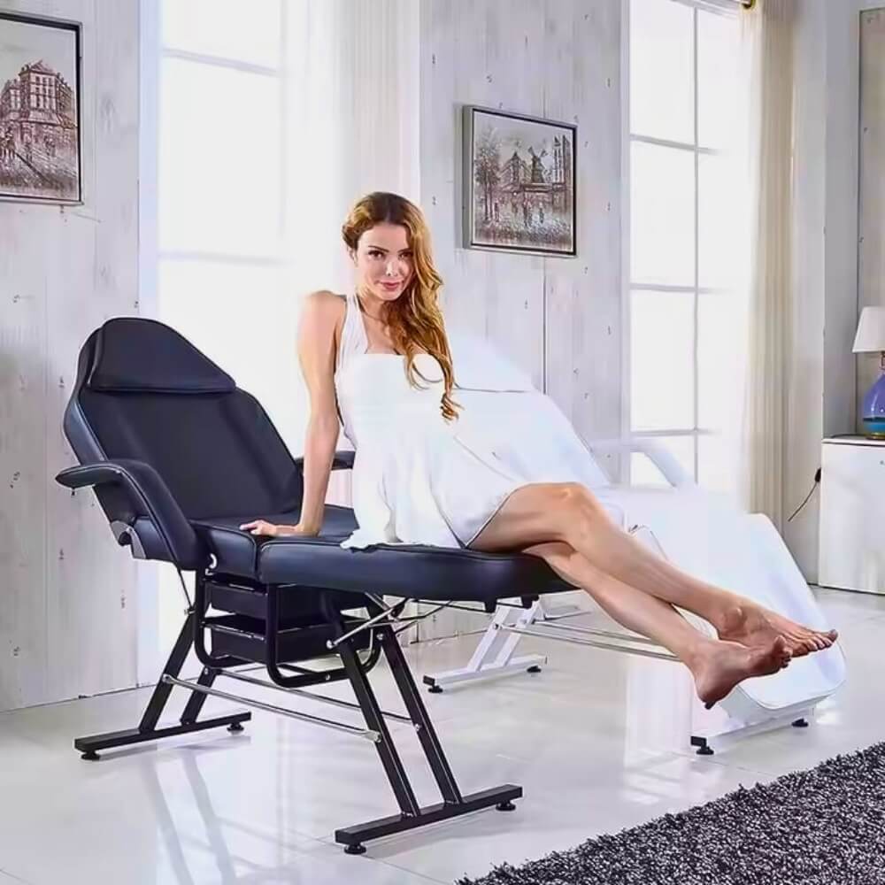 A woman sitting on an aromatherapy massage bed sold by WorkZen Interiors