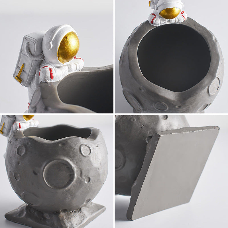 A Astronaut Desk Pen Holder sold by WorkZen Interiors