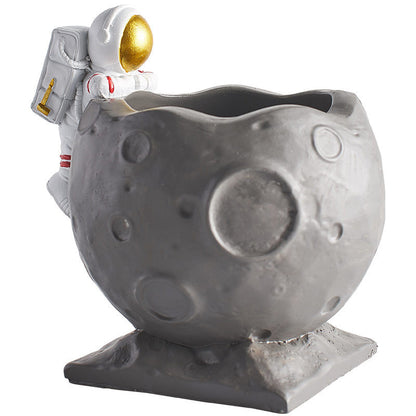 A Astronaut Desk Pen Holder sold by WorkZen Interiors