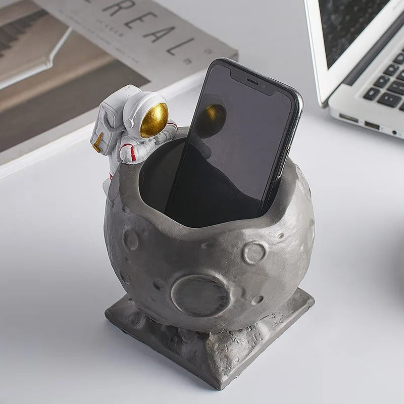 A Astronaut Desk Pen Holder sold by WorkZen Interiors