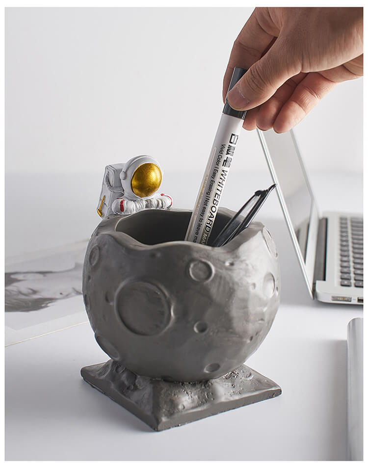 A Astronaut Desk Pen Holder sold by WorkZen Interiors