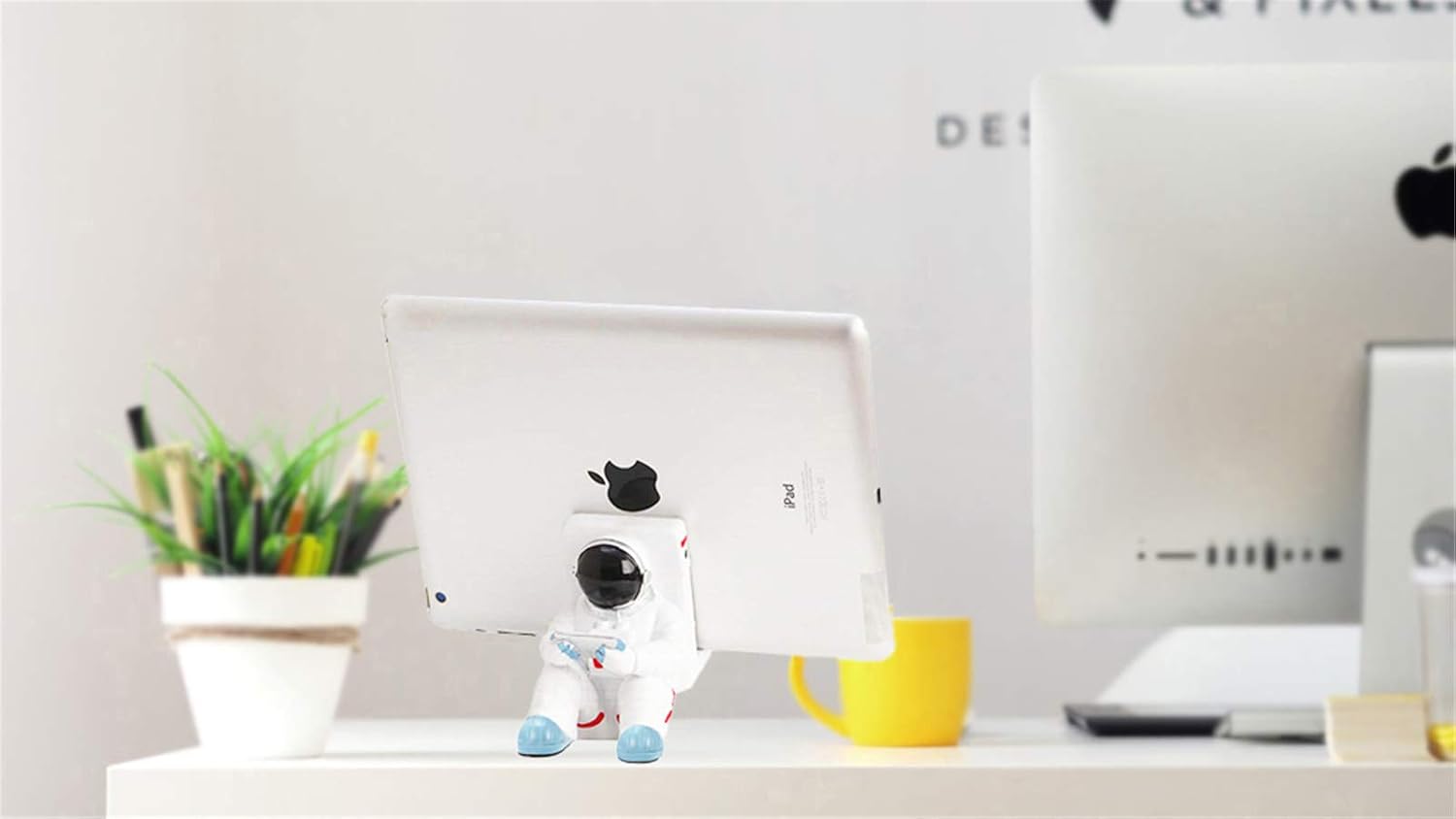 A white astronaut desk phone holder sold by WorkZen Interiors