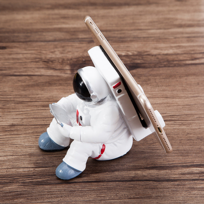 A white astronaut desk phone holder sold by WorkZen Interiors