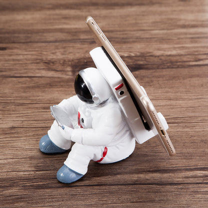 A white astronaut desk phone holder sold by WorkZen Interiors