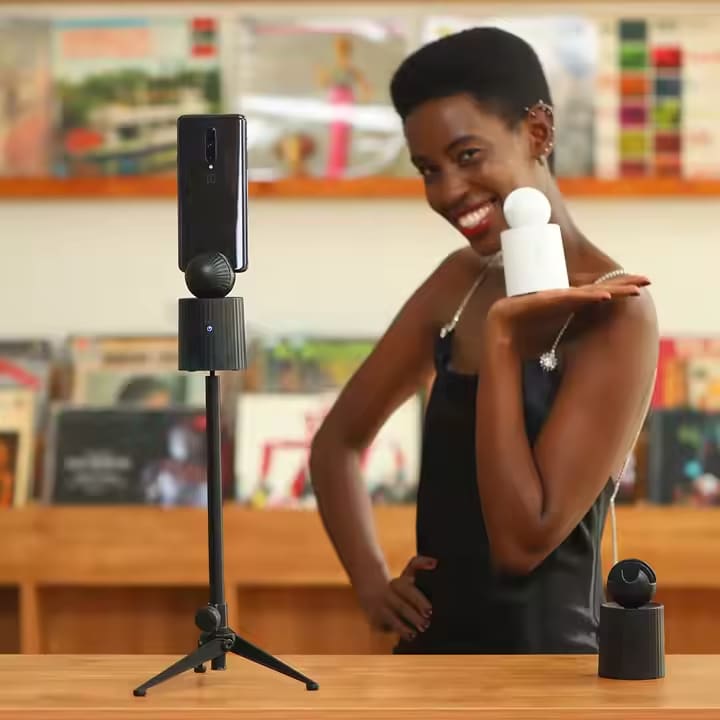 A white auto object tracking phone holder sold by WorkZen Interiors