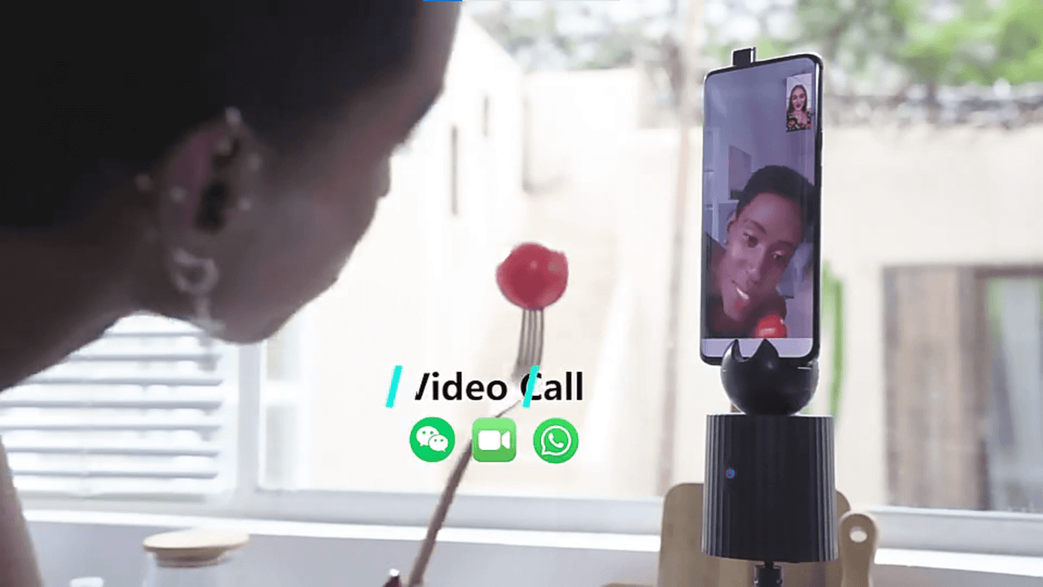 A black auto object tracking phone holder sold by WorkZen Interiors